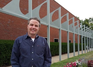 Ken smiles following completion of dental implant treatment with an AvaDent prosthesis.